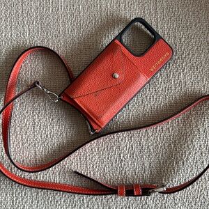 Used bandolier Casey iPhone 15 pro max 
Orange/silver
